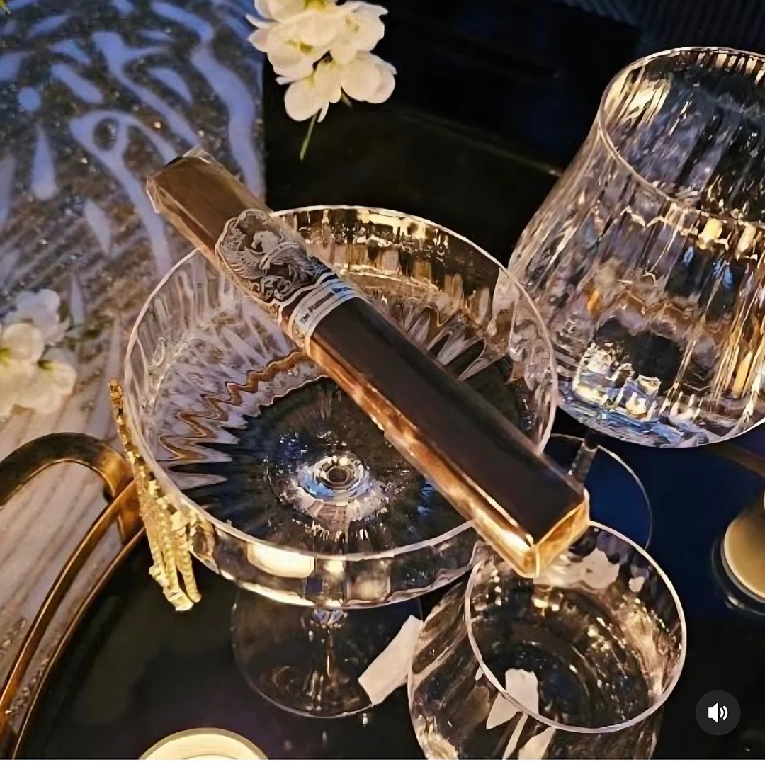 A Platinum Reserve in its tube resting on crystal glassware