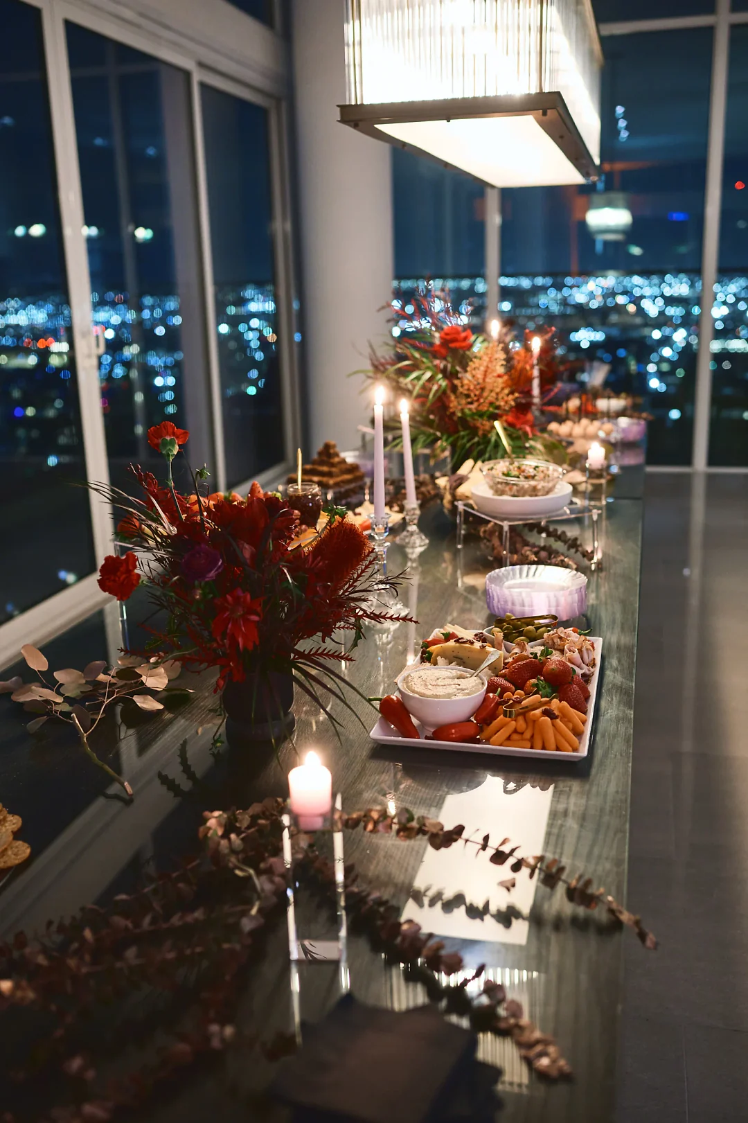 A candlelit table set for The Rose Gold Reserve launch party
