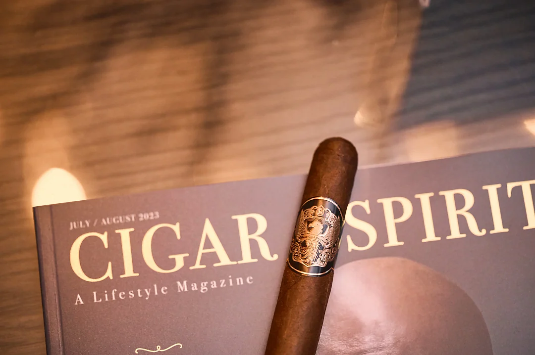 A Rose Gold Reserve cigar on a copy of Cigar & Spirits Magazine